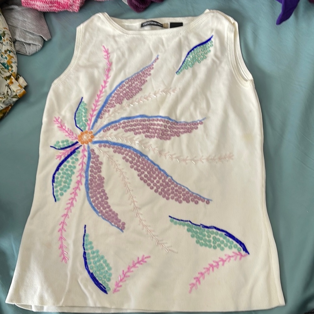 Here is a nice sleeveless decorated sweater